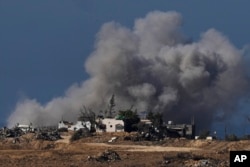 Smoke rises following an Israeli bombardment in the Gaza Strip, as seen from southern Israel, Jan.7, 2024.