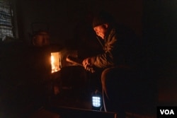 Alexandr, 67, stays in Chasiv Yar, Ukraine, despite government and aid workers warning residents to leave while they can still evacuate safely, on April 3, 2023. (Yan Boechat/VOA)