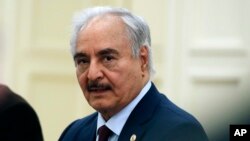 FILE - Libyan commander Khalifa Haftar is seen at a meeting in Athens, Greece, Jan. 17, 2020. The Libyan military commander who once lived in Virginia was facing a U.S. lawsuit over alleged war crimes in Libya.