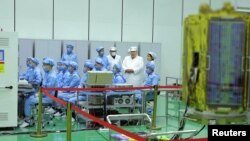 FILE - North Korean leader Kim Jong Un and his daughter Kim Ju Ae inspect the country's first military reconnaissance satellite, in Pyongyang, North Korea, May 16, 2023, in this image released by North Korea's Korean Central News Agency on May 17, 2023.