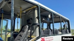 A handout picture shows a bus, which local authorities say was damaged in a Ukrainian drone attack as it was taking people to work near the village of Berezovka, in the Belgorod Region, Russia May 6, 2024.