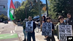Pro-Palestinian demonstrators chant slogans outside the Israeli consulate in Atlanta on Oct. 8, 2023.