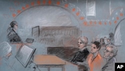 This courtroom drawing shows Massachusetts Air National Guardsman Jack Teixeira, seated second from right, appearing in U.S. District Court in Boston, Massachusetts, April 19, 2023.