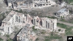 This photo taken from a drone video provided by Ukraine Patrol Police shows devastation in Chasiv Yar, Ukraine, April 29, 2024.