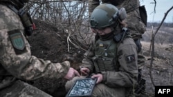 Soldiers of the Ukrainian Volunteer Army hold their positions at the front line near Bakhmut, Donetsk region, on March 11, 2023, 