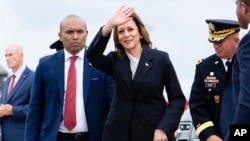 Vice President Kamala Harris waves as she arrives at Delaware Air National Guard Base in New Castle, Delaware, July 22, 2024. 