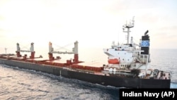 FILE — This photo provided by the Indian Navy shows the U.S.-owned ship Genco Picardy that came under attack Wednesday from a bomb-carrying drone launched by Yemen's Houthi rebels in the Gulf of Aden, Jan.18, 2024. The ship reported damage, but no injuries. (Indian Navy via AP) 
