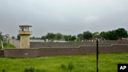 A guard is seen atop a watch tower at Attock prison where Pakistan's former Prime Minister Imran Khan was taken following his conviction a day earlier on corruption charges, in Attock, Pakistan, Aug. 6, 2023. 