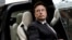 FILE - Tesla Chief Executive Officer Elon Musk, who also owns the X platform, formerly known as Twitter, gets in a Tesla car as he leaves a hotel in Beijing, China, May 31, 2023.