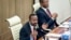 FILE - Ethiopia's Prime Minister Abiy Ahmed, left, accompanied by House speaker Tagesse Chafo, right, addresses the parliament in the capital Addis Ababa, Ethiopia on Nov. 15, 2022.