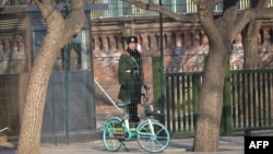 A Chinese paramilitary police stands guard outside the British embassy in Beijing on Jan. 8, 2024.