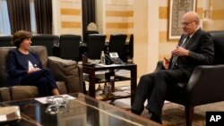 French Foreign Minister Catherine Colonna, left, meets with Lebanese caretaker Prime Minister Najib Mikati, right, at the government palace in Beirut, Lebanon, Dec. 18, 2023.