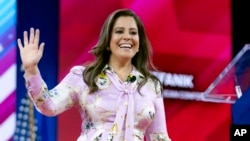 FILE - Rep. Elise Stefanik waves to supporters at conference in Oxon Hill, Maryland, Feb. 23, 2024.