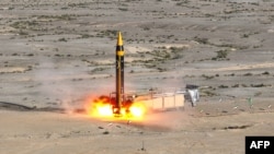A handout picture provided by Iran's Defense Ministry on May 25, 2023, shows the testing of the fourth generation Khorramshahr ballistic missile, named Khaibar, at an undisclosed location. (AFP photo / HO /Iran Defense Ministry Website) 