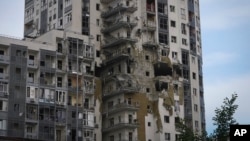An apartment building is seen damaged after a Russian missile attack, in Kharkiv, Ukraine, May 14, 2024.