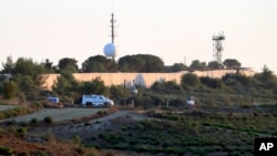FILE - U.N. peacekeepers patrol on the Lebanese side of the Lebanese-Israeli border in the southern village of Bustan, July 12, 2023.
