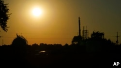The Denka Performance Elastomer Plant sits at sunset in Reserve, La., Sept. 23, 2022. Reserve is in the southeastern part of the state, part of a corridor surrounded by chemical plants.