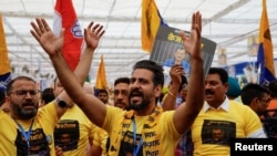 Supporters of Aam Aadmi Party attend a protest rally against the arrest of Aam Aadmi Party's main leader and Delhi Chief Minister Arvind Kejriwal, at the Ramlila Ground in New Delhi, March 31, 2024.