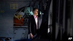 FILE - Photo released by Belgian Government, Belgium's Olivier Vandecasteele looks out the window of a Belgian military plane in Oman taking him to Belgium, May 26, 2023.