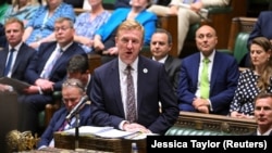 FILE - British Deputy Prime Minister Oliver Dowden speaks during the Prime Minister's Questions at the House of Commons in London, Britain, July 12, 2023. 