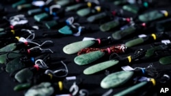 Pounamu carvings are displayed for sale at a stall during Matariki Whanau Day at the Wainuiomata Community Hub, Wellington, New Zealand, on June 22, 2024.