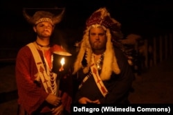 Boy Scouts Order of the Arrow Vigil Honor members in regalia performing in a "call-out" ceremony at Kia Kima Scout Reservation in Hardy, Arkansas.