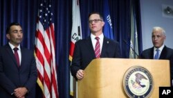 US Attorney Randy S. Grossman for the Southern District of California, center, speaks during a press conference at the US Attorney's Office for the Southern District of California on Aug. 3, 2023, in San Diego. 