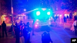 A police bus loaded with protesters arrested at Columbia University departs an entrance to the campus on April 30, 2024, in New York.