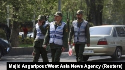 FILE- Iran police patrol a street amid the implementation of the new hijab surveillance in Tehran, Iran, April 15, 2023.