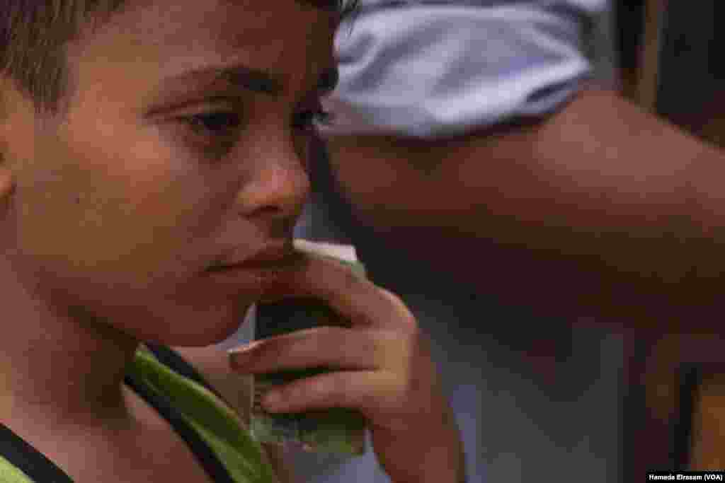 With a ration card in hand, Flobater waits inside a bakery for his family&rsquo;s daily subsidized bread. Egypt&rsquo;s bread subsidy program covers a maximum of 150 loaves a month per family member. Cairo, Egypt, June 24, 2024.&nbsp;(Hamada Elrasam/VOA)