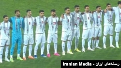 تیم ملی ایران با چفیه فلسطینی.