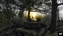 A Ukrainian self-propelled artillery system fires towards the Russian positions at the front line near Bakhmut, Donetsk region, Ukraine, Sept. 1, 2023.