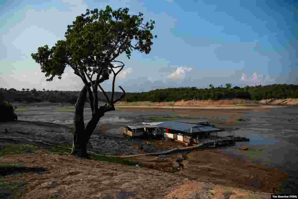 A floating restaurant is stranded in a dried-up lake on the outskirts of Manaus, Oct. 3, 2023.