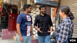 Pavni Mishra, right, and Satvik Sharma, left, are students at Delhi University. (Anjana Pasricha/VOA)