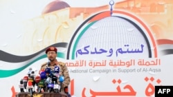 FILE - Houthi military spokesman Brigadier Yahya Saree is shown delivering a statement during a march in solidarity with the people of Gaza in this Dec. 15, 2023, photo from Sanaa, Yemen.