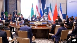 In this photo released by the Russian Foreign Ministry Press Service, top diplomats from Russia, China, Iran and Pakistan attend a conference on regional security with the situation in Afghanistan in Samarkand, Uzbekistan, April 13, 2023.