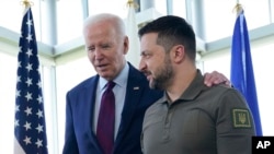 FILE - U.S. President Joe Biden walks with Ukrainian President Volodymyr Zelenskyy during the G7 Summit in Hiroshima, Japan, May 21, 2023. Zelenskyy is expected to meet with Biden at the White House after next week's U.N. General Assembly meeting in New York.