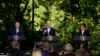 South Korea's President Yoon Suk Yeol, left, and Japan's Prime Minister Fumio Kishida, right, listen as President Joe Biden speaks during a news conference, Aug. 18, 2023, at Camp David, the presidential retreat, near Thurmont, Md.