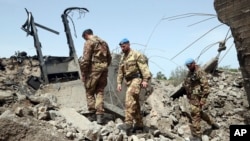 U.N. peacekeepers inspect a bridge hit by an Israeli airstrike, in Maaliya, Lebanon, April 7, 2023. Israel launched rare strikes in southern Lebanon early Friday and bombed targets in the Gaza Strip. The strikes followed violence this week at Jerusalem's most sensitive holy site.