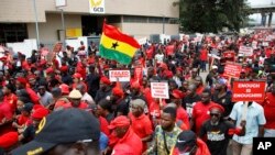 Thousands participate in a protest in Accra, Ghana, demanding the resignation of the Bank of Ghana's governor, Ernest Addison, Oct. 3, 2023.