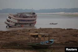 Boats are seen stranded at David's Marina, as the water level at a major river port in Brazil's Amazon rainforest hit its lowest point in at least 121 years on Monday, at the Rio Negro River in Manaus, Brazil, Oct. 16, 2023.