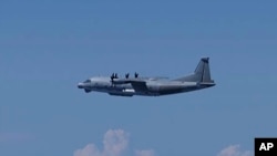This photo provided by Japan's Ministry of Defense shows a Chinese Y-9 reconnaissance plane on Aug. 26, 2024. According to the ministry, the plane violated Japanese airspace above Danjo Islands in the South China Sea for two minutes while circling around the area.