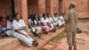 A prison officer addresses female inmates at Zomba Prison in Malawi. Authorities say prison facilities in Malawi were not built with women in mind. (Lameck Masina/VOA)
