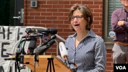 Hala Amer, mother of a George Washington University student, speaks at a press conference with faculty and alumni to call on the university to negotiate with student protesters, May 8, 2024, in Washington. (Melos Ambaye/VOA)