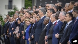 Participants pose for the group photo at the Summit on Peace in Ukraine, in Obburgen, Switzerland, June 15, 2024.