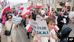 Anti-abortion demonstrators march in support of every conceived life and against steps taken by the new government to liberalize Poland's strict law and allow termination of pregnancy until the 12th week, in Warsaw, April 14, 2024.
