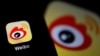 FILE - The logo of Chinese social media app Weibo is seen on a mobile phone, Dec. 7, 2021. 