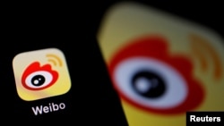 The logo of Chinese social media app Weibo is seen on a mobile phone in this illustration picture taken Dec. 7, 2021. 