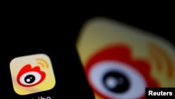 The logo of Chinese social media app Weibo is seen on a mobile phone in this illustration picture taken Dec. 7, 2021. 