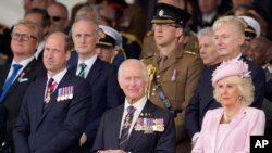 Britain's Prince William, from left, Britain's King Charles III and Queen Camilla attend a D-Day national commemoration event in Portsmouth, England, June 5, 2024.